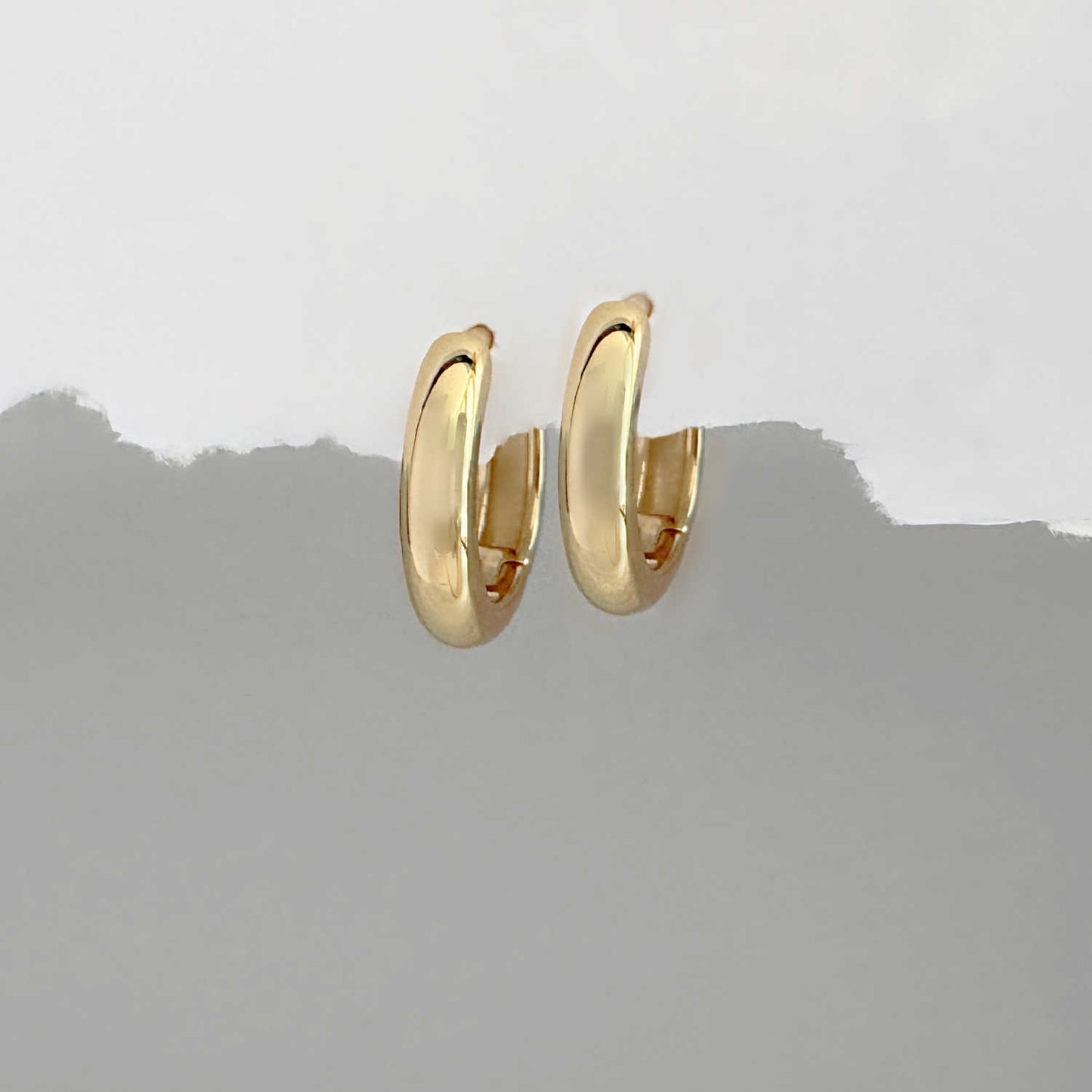 Pair of small gold hoop huggie earrings for helix or lobe piercings