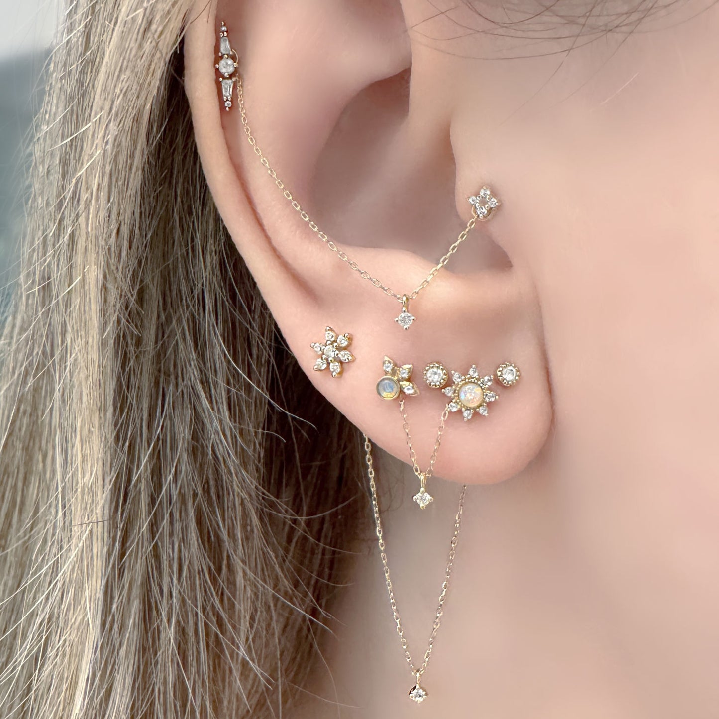 Woman Wearing Set of 3 Double Piercing Connector Chain Earring Charms, 14k Gold & Diamond Helix to Lobe Chains
