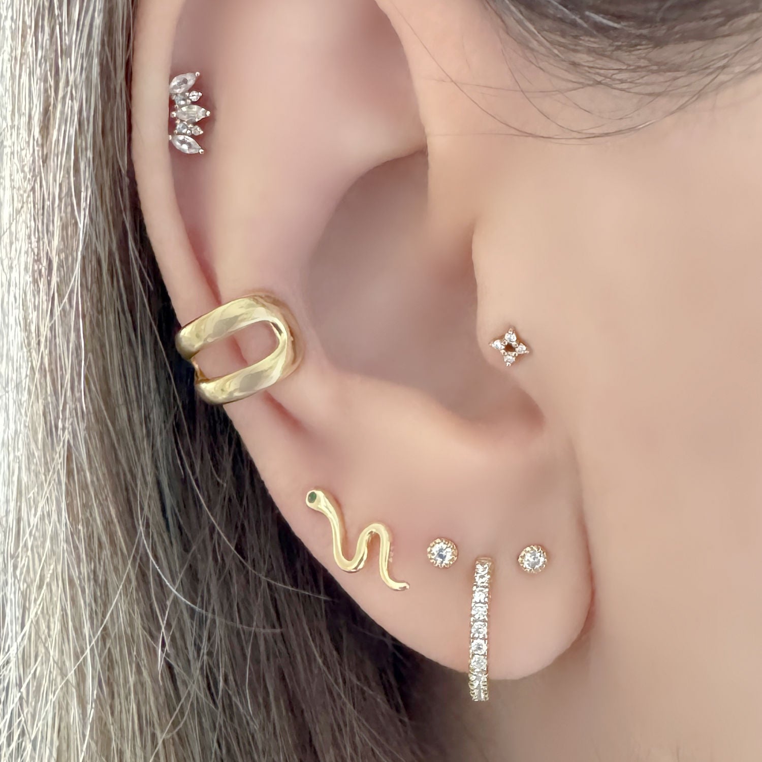 Chunky Gold Ear Cuff and Snake Stud Earrings on Model, Two of Most
