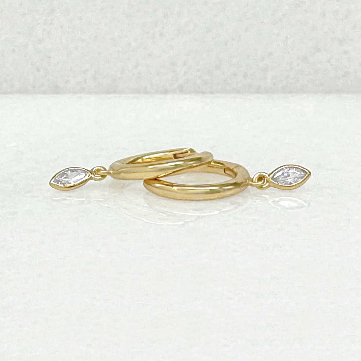 Gold Huggie Earrings with Charm