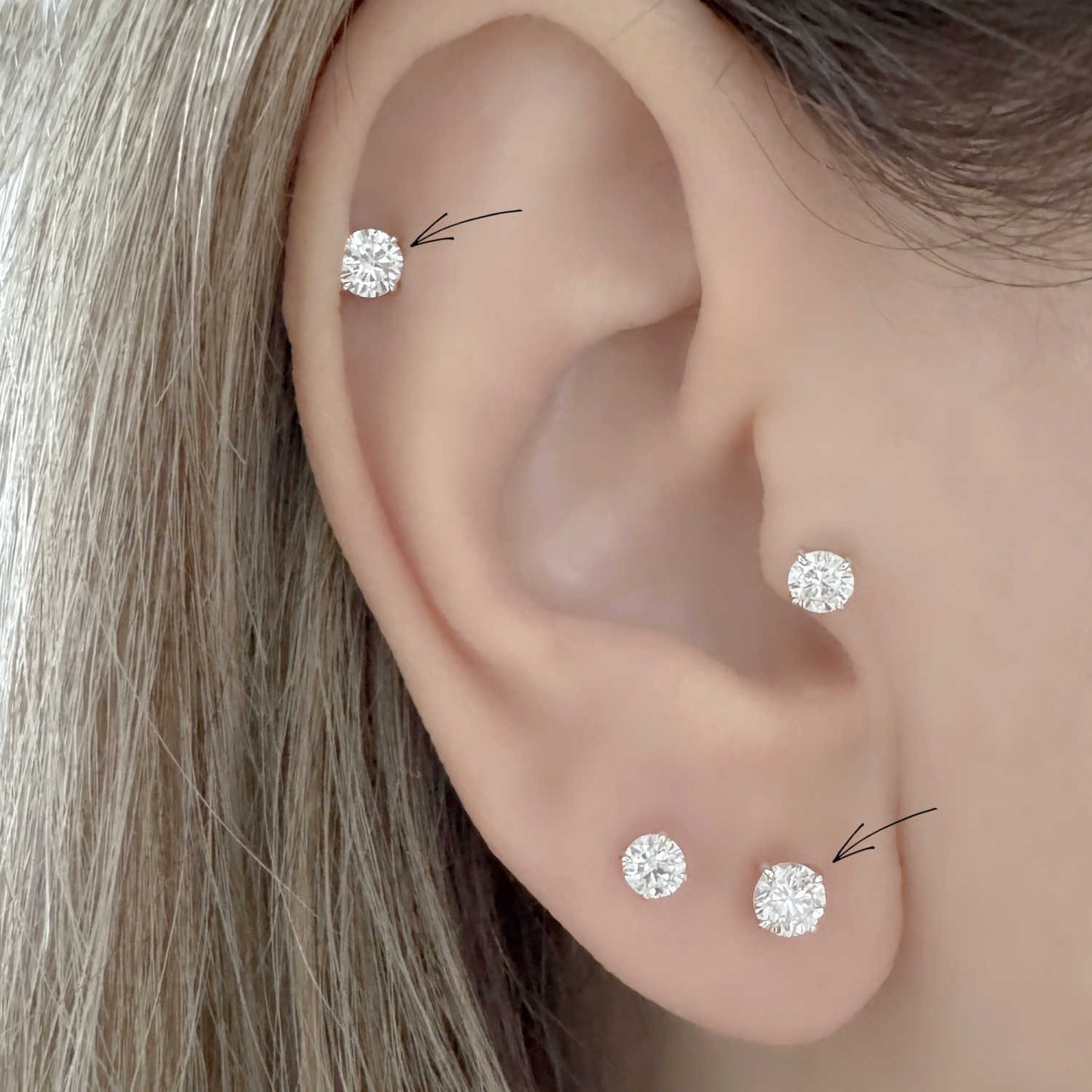 Woman Wearing 14k White Gold Lab Grown Diamond Stud Earrings in Cartilage and Lobe