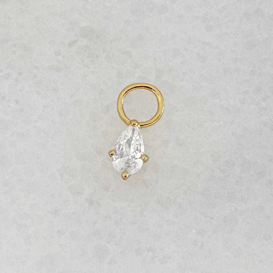 Gold hoop earring charm with a pear teardrop-shaped cubic zirconia gemstone