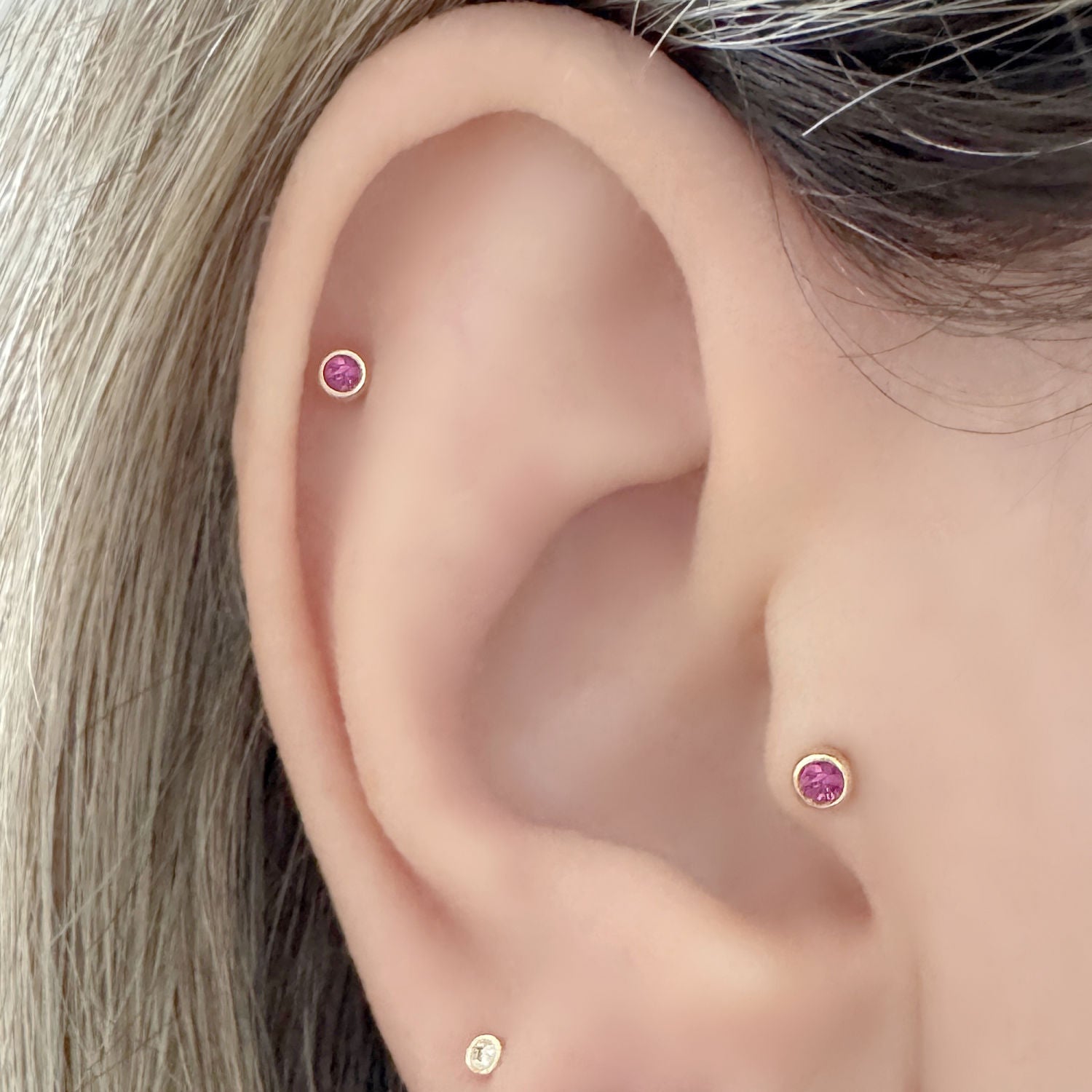 Woman Wearing Pink Sapphire Flat Back Earrings in Tragus & Helix, 14k Gold  Cartilage Piercing Jewelry from Two of Most