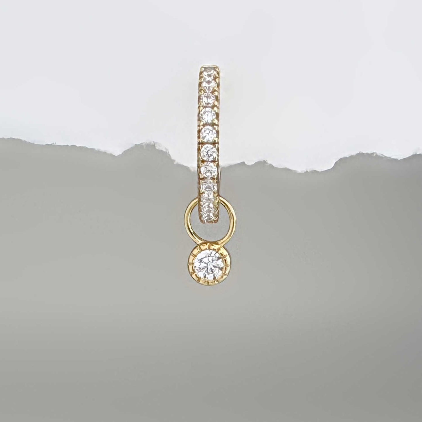 Gold bezel & gemstone earring charm on a diamond huggie hoop earring