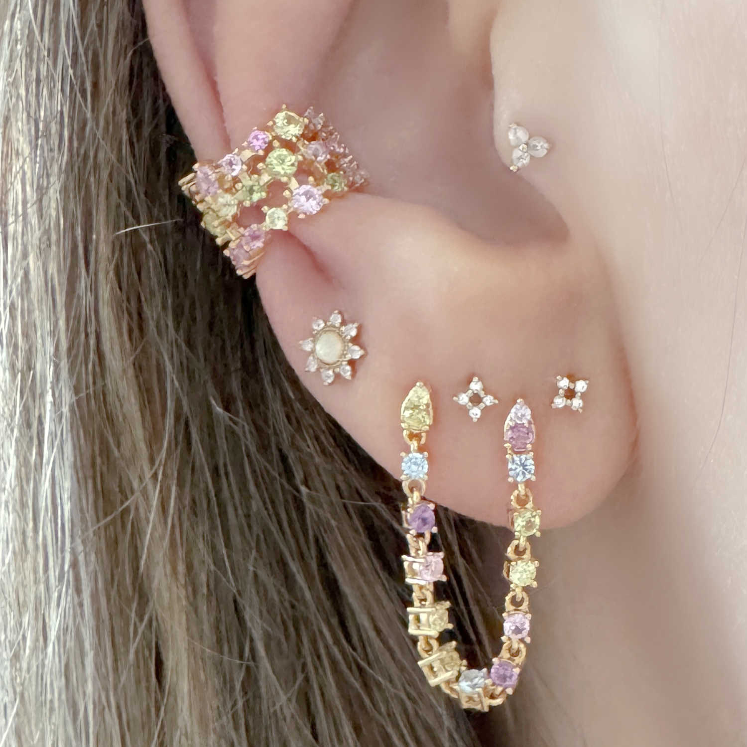 Woman Wearing Multicolored Gemstone Ear Cuff and Tennis Double Piercing Earring