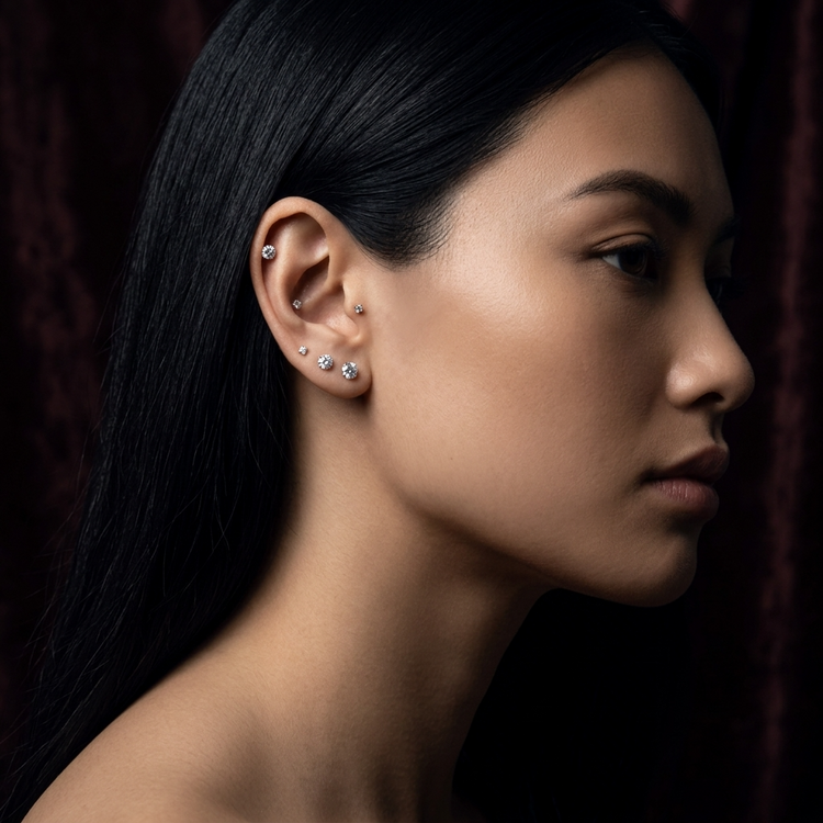 Woman Wearing White Gold & Diamond Flat Back Earrings