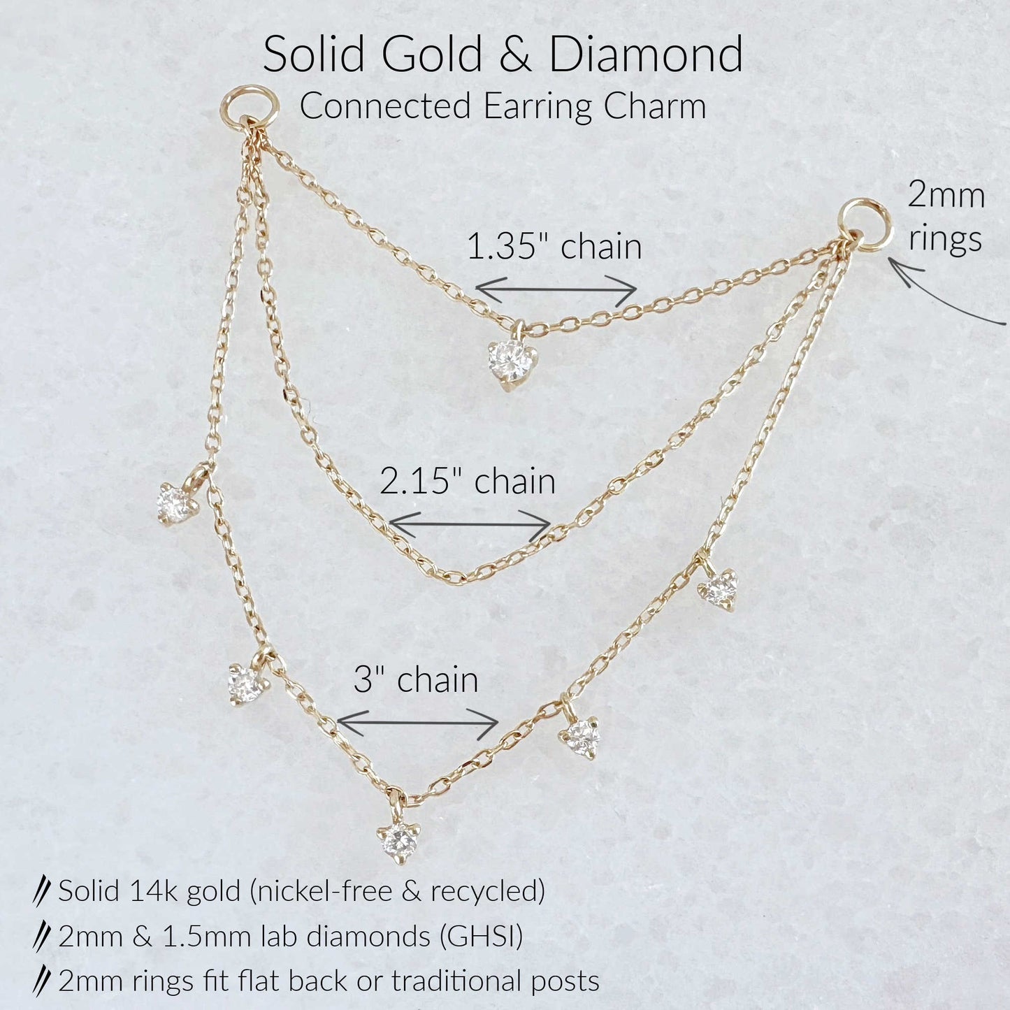 Gold and diamond connected three chain earring charm shown on a light textured background with labeled chain lengths and ring measurements.