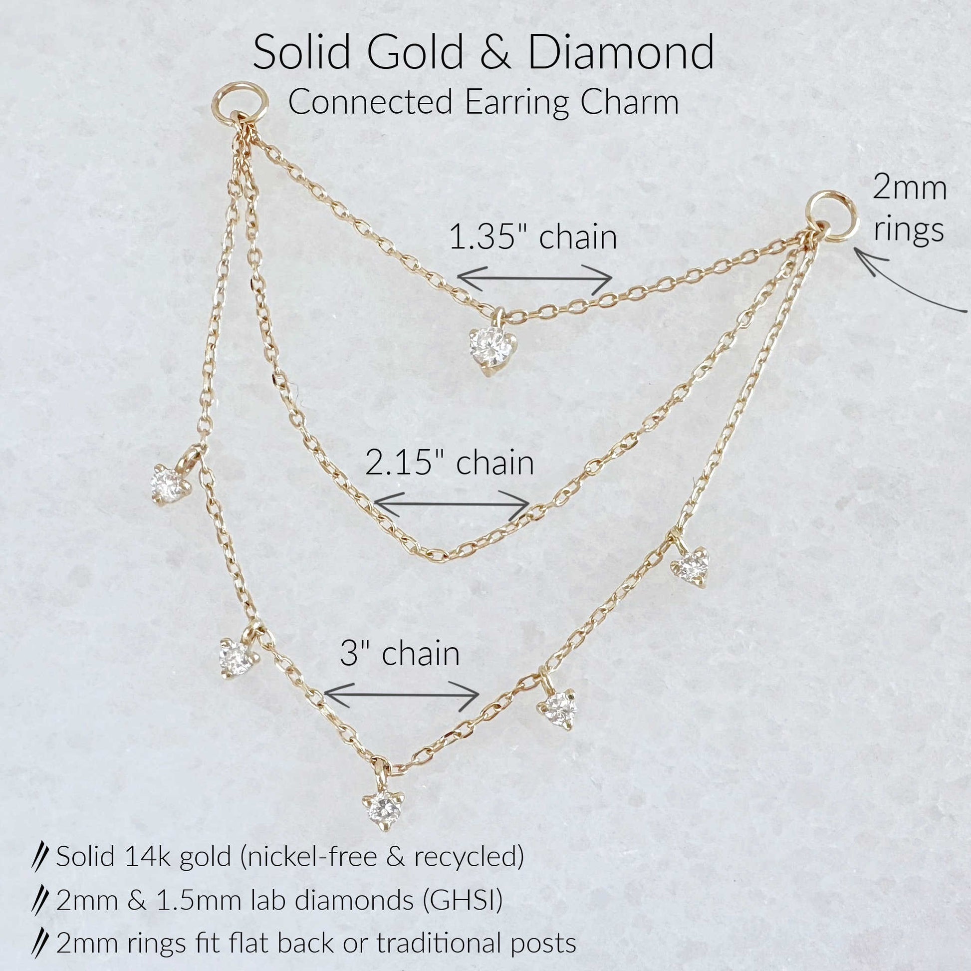 Gold and diamond connected three chain earring charm shown on a light textured background with labeled chain lengths and ring measurements.