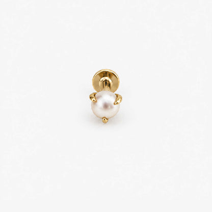 A single 14k gold flat back stud earring featuring a round, lustrous white pearl held in a prong setting, shown against a plain white background.