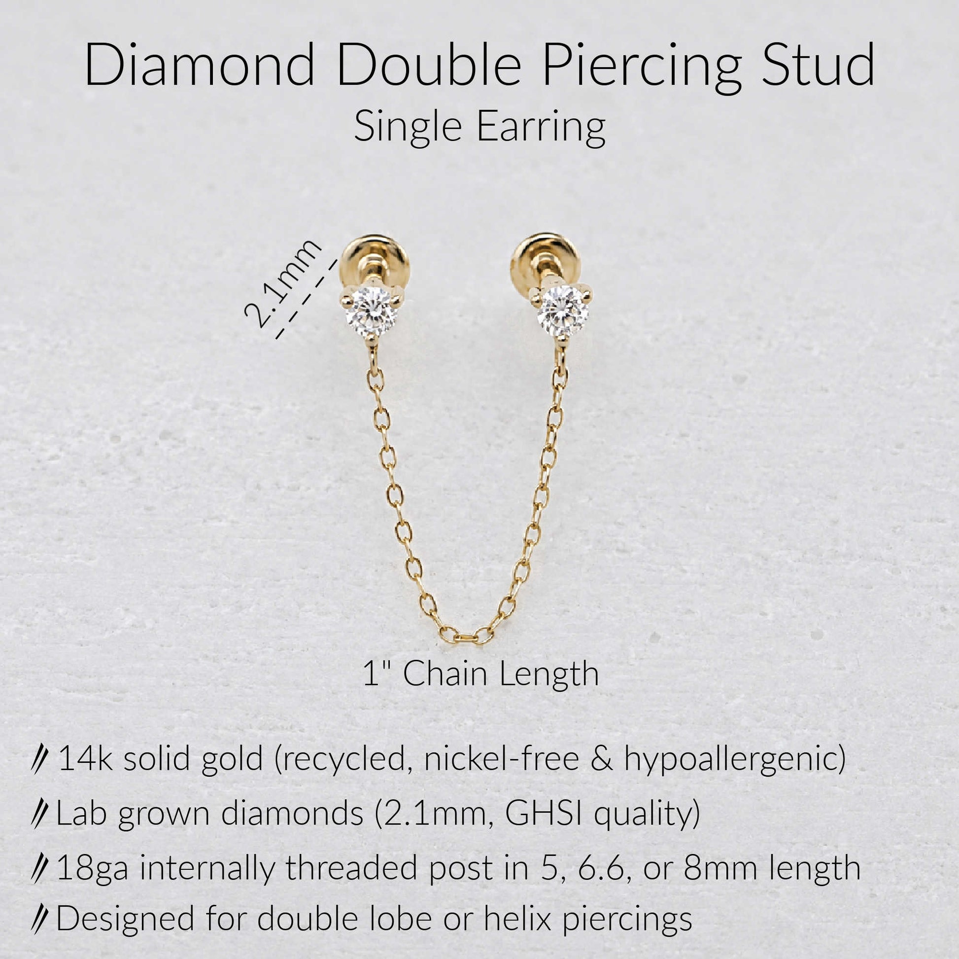 Gold double piercing earring with a 1-inch chain link and lab-grown diamonds, shown on a light textured background with product specifications and dimensions.
