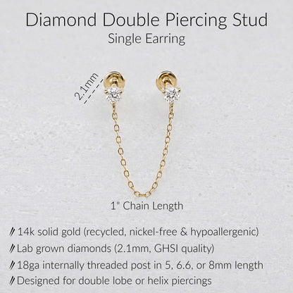 Gold double piercing earring with a 1-inch chain link and lab-grown diamonds, shown on a light textured background with product specifications and dimensions.