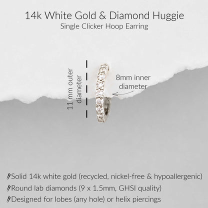 A 14k white gold single-clicker huggie hoop earring with round lab diamonds, shown on a light gray background with text detailing its dimensions (11mm outer diameter, 8mm inner diameter) and material specifications.