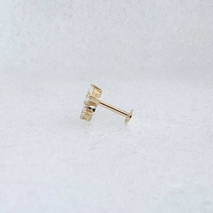Side view of a solid 14k gold flat back stud earring with 1/2 Carat of diamonds 