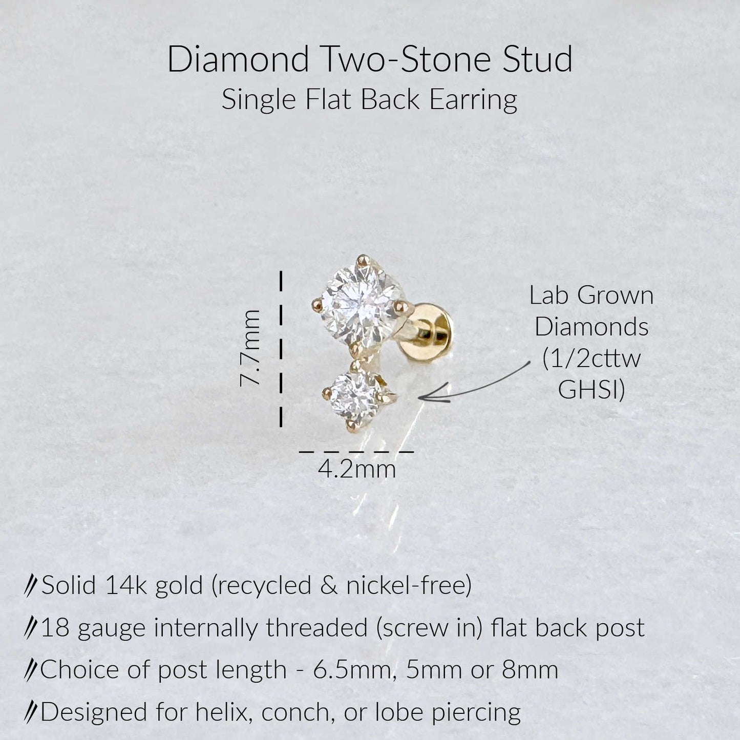 A single flat back earring stud shown on a light textured background with text labels. The earring is made of solid 14k gold with two lab-grown diamonds of 1/2 carat weight.