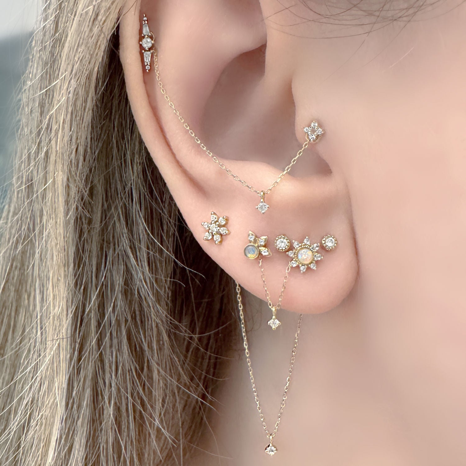 Woman Wearing Set of 3 Double Piercing Connector Chain Earring Charms, 14k Gold & Diamond Helix to Lobe Chains