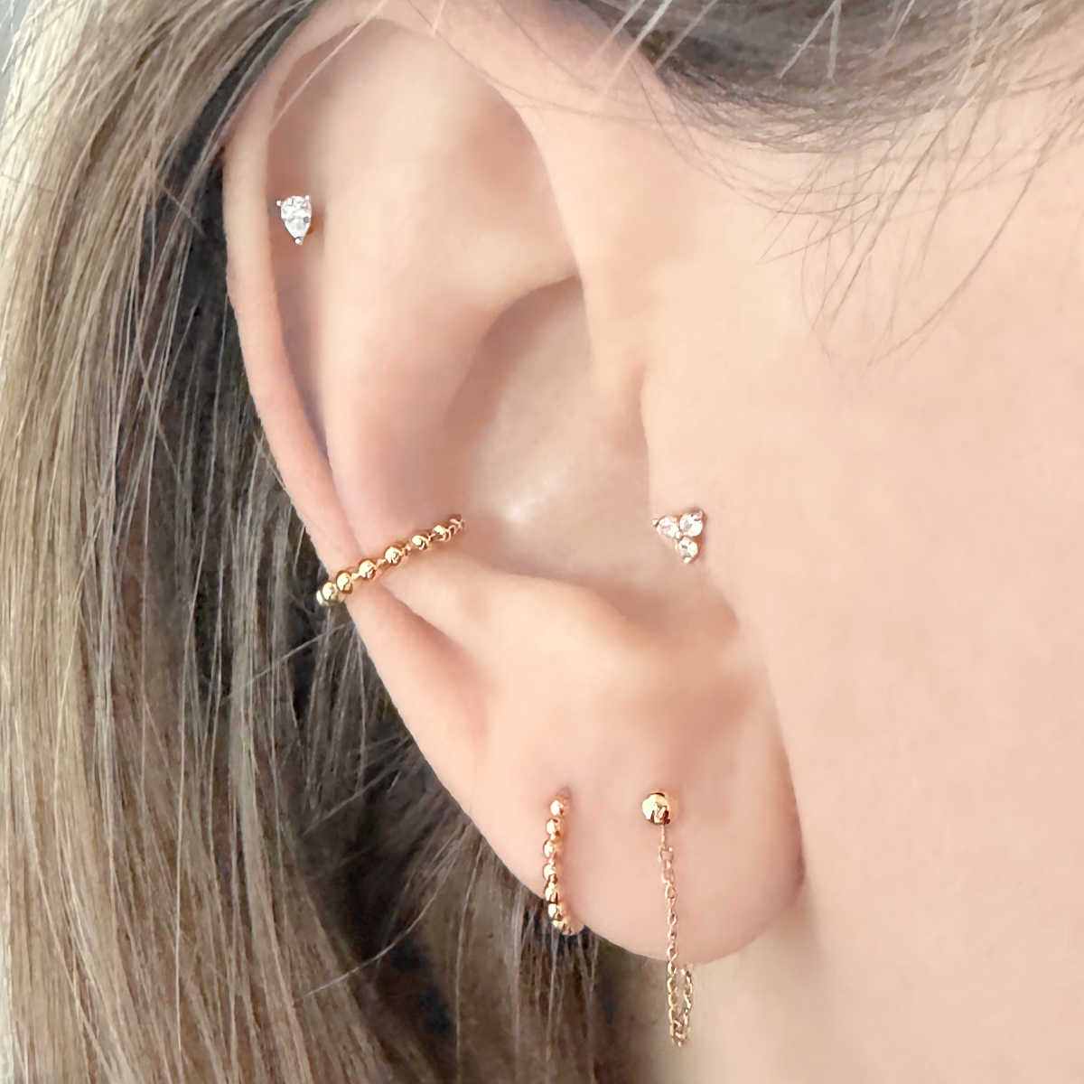Gold Beaded Huggies | 14K Cartilage, Helix Hoop Earrings on Model
