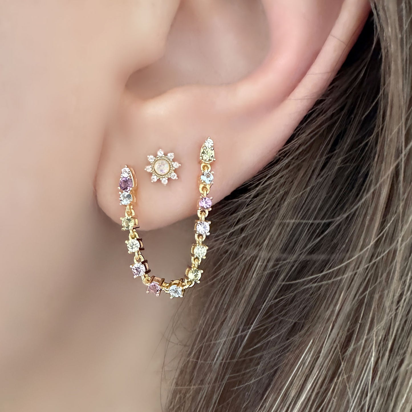 Gold Chain Tennis Earrings, Connected Double Piercing Studs with Multicolor Gems, on Model