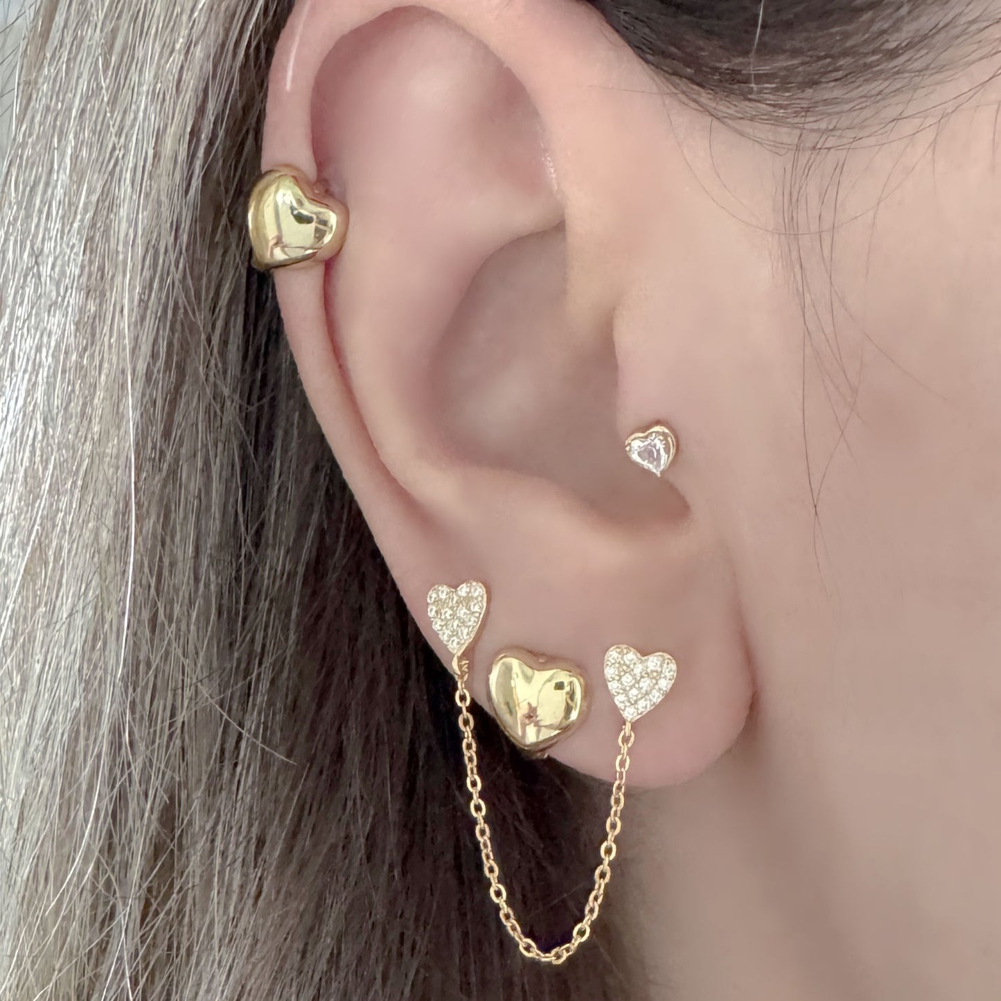 Gold Heart Hoop Earrings and Double Piercing Studs on Model