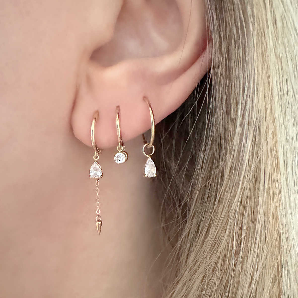 Huggie Earrings with Charms on Model | 14k Gold Cartilage Hoops from Two of Most