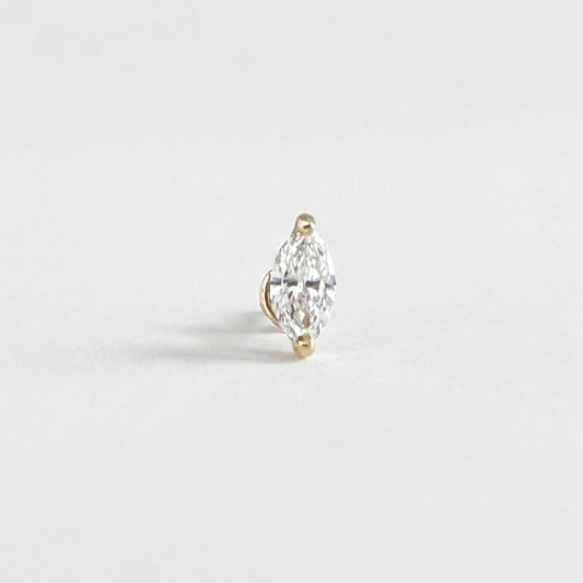 A single marquise-cut diamond stud Flat Back Cartilage Piercing earring in a 14k yellow gold setting, photographed on a clean, light gray background.
