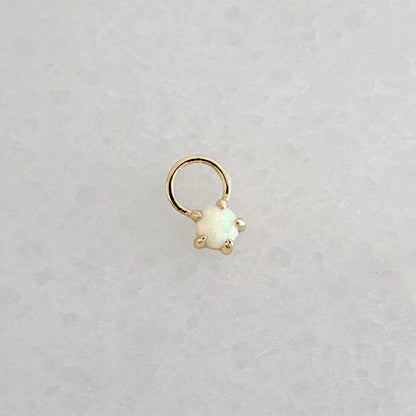 Gold hoop earring charm with a round opal gemstone