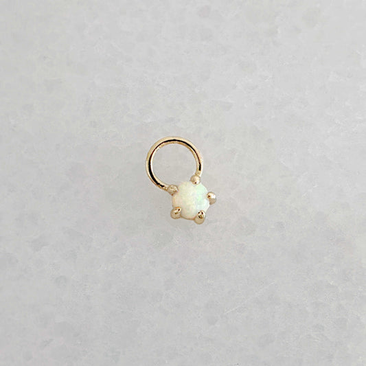 Gold hoop earring charm with a round opal gemstone