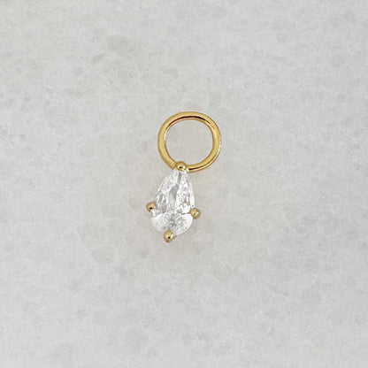 Gold hoop earring charm with a pear teardrop-shaped cubic zirconia gemstone