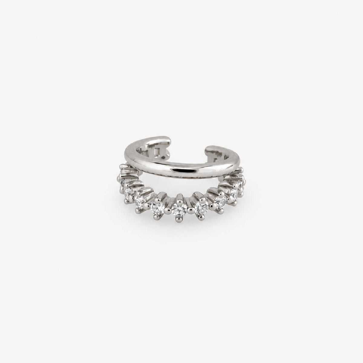 A silver ear cuff earring adorned with a row of small clear cubic zirconia stones, shown on a light gray background.