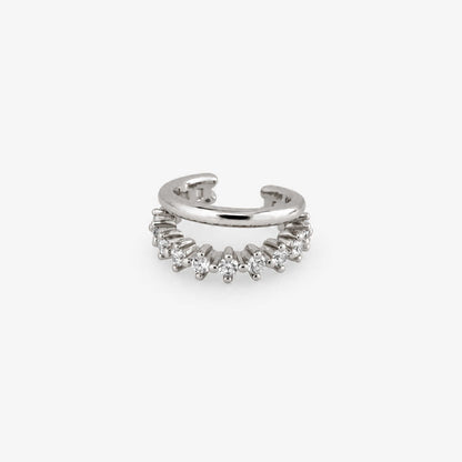 A silver ear cuff earring adorned with a row of small clear cubic zirconia stones, shown on a light gray background.
