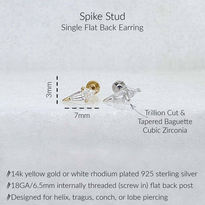 Spike stud single flat back earring with dimensions (3mm height, 7mm width), and material notes. The earring has a tapered baguette and trillion cut cubic zirconia front and a screw-in flat back post in yellow gold or white rhodium plated sterling silver.