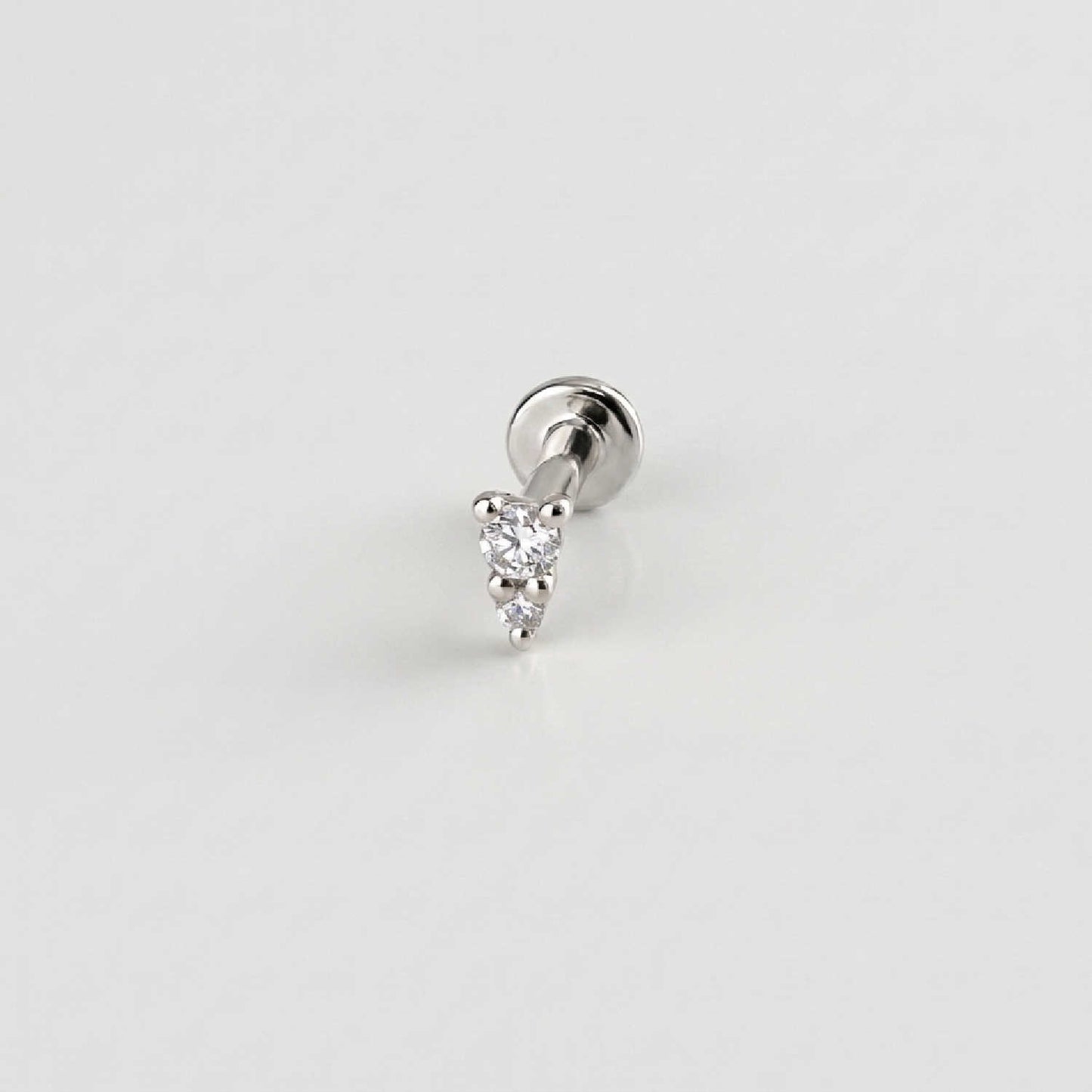A solid 14k white gold flat back stud earring with two diamonds. Tiny Diamond Cartilage Piercing Jewelry for Helix, Tragus, Conch or Lobe