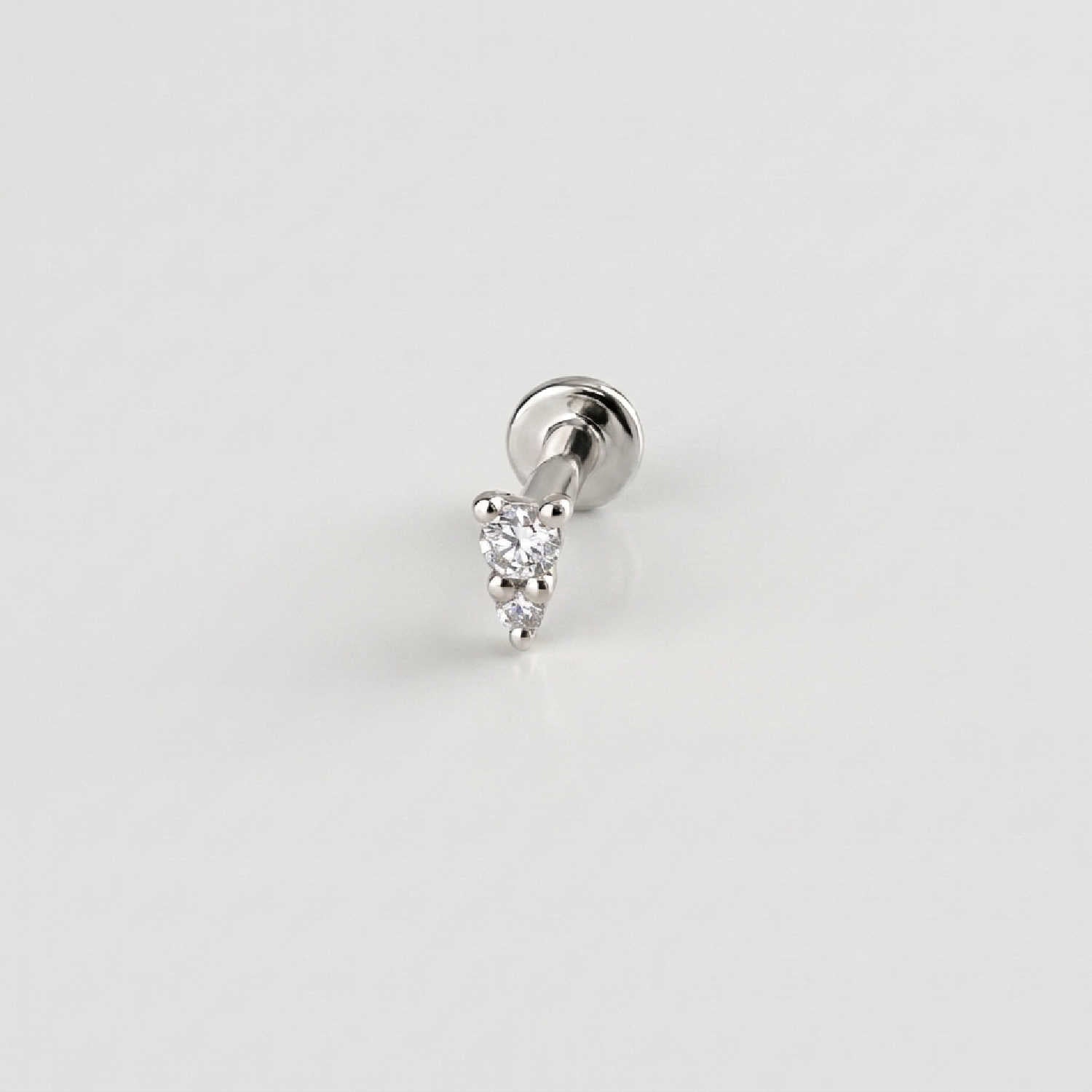 A solid 14k white gold flat back stud earring with two diamonds. Tiny Diamond Cartilage Piercing Jewelry for Helix, Tragus, Conch or Lobe