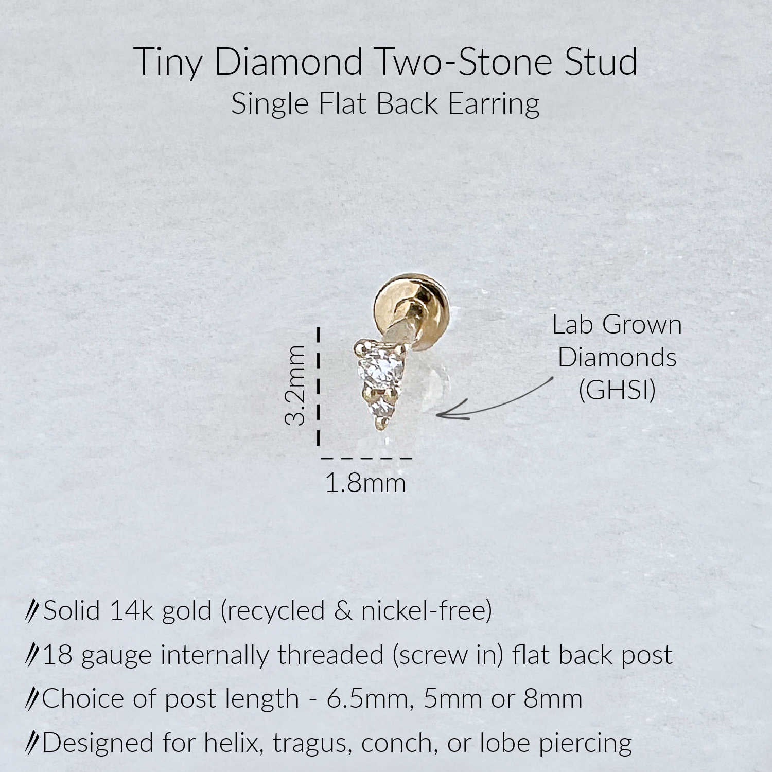 A product information graphic for a Tiny Diamond Two-Stone Stud single flat back earring. The image shows a small gold earring with a diamond gemstone, accompanied by text detailing its features: solid 14k yellow gold, 18 gauge flat back, and GHSI lab grown diamonds.