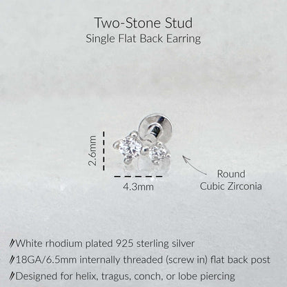 A product diagram for a two-stone stud earring, showing a silver flat back stud with two clear cubic zirconia stones and dimension labels of 2.6mm width and 4.3mm height.