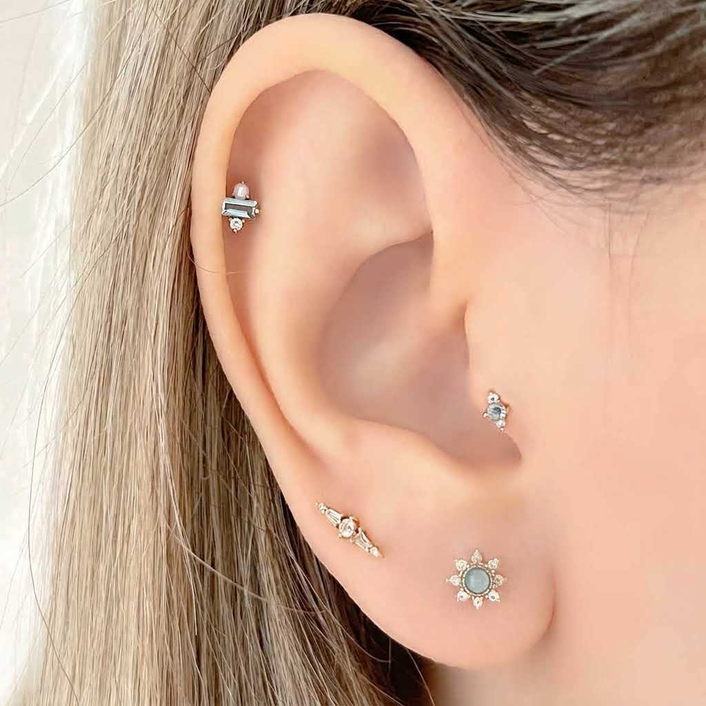 Woman Wearing Blue Gemstone Earring Stack, 14k Gold Flat Back Studs for Cartilage