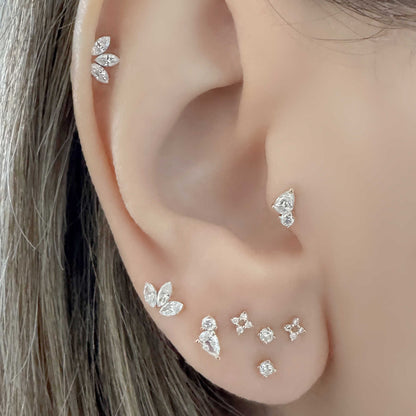Woman Wearing Lab Grown Diamond Stud Earrings in Helix, Tragus & Lobe | 14k Lotus & Pear Shaped Flat Back Cartilage Piercing Studs