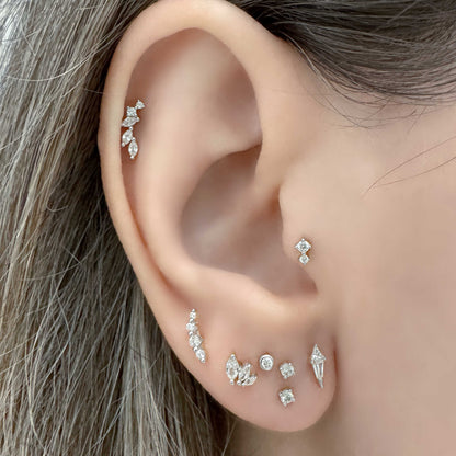 Woman wearing 14k gold plated silver flat back earrings in helix, tragus, cartilage, lobe